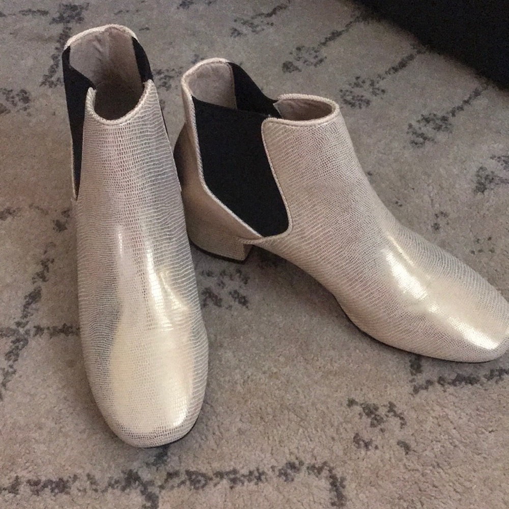 Brand New gold booties with black detail on sides